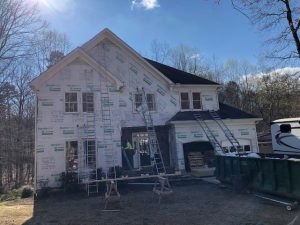 house that had old siding removed with new insulation applied