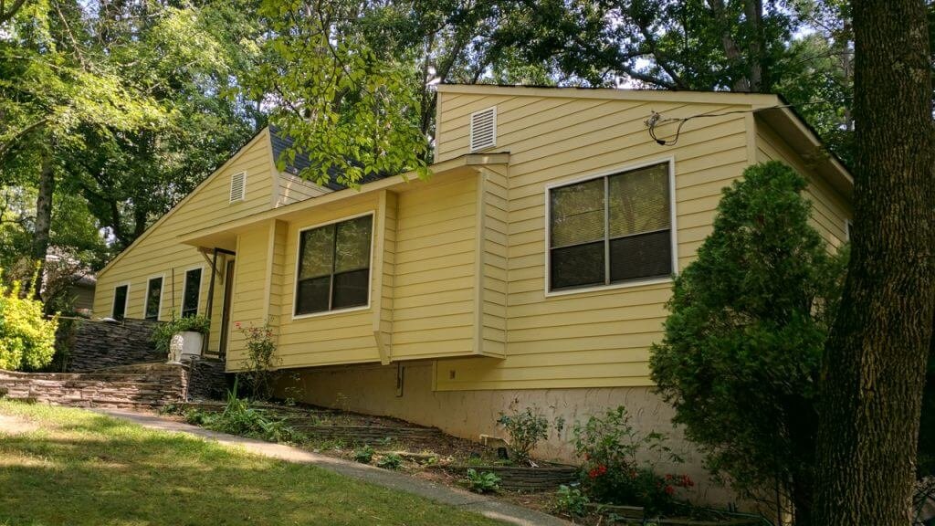 home with old yellow siding