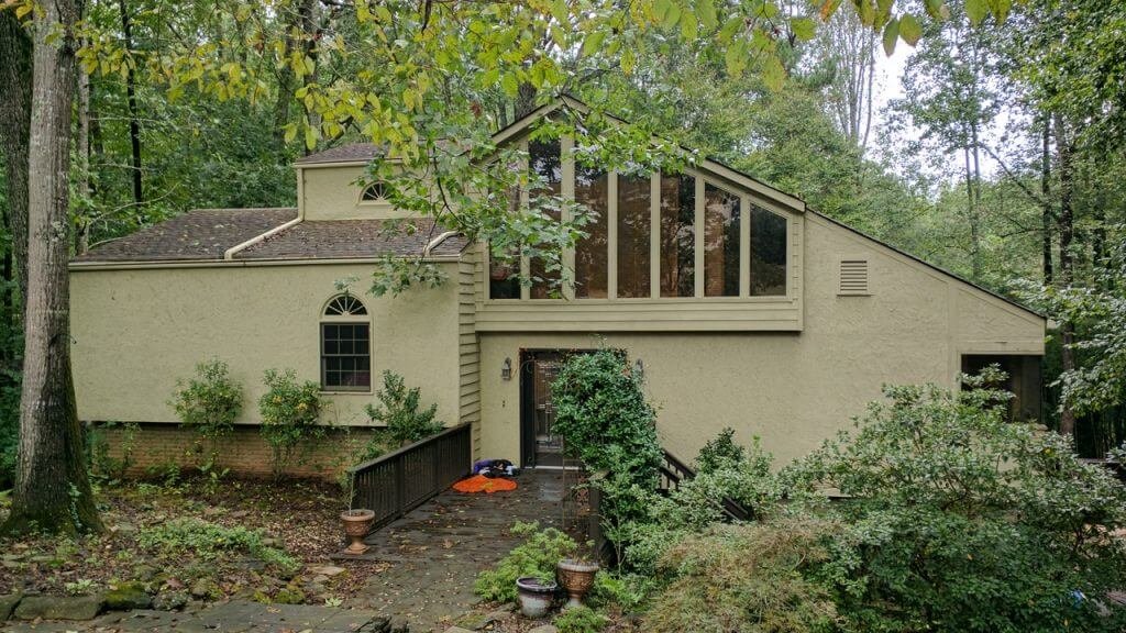 home with old greenish stucco