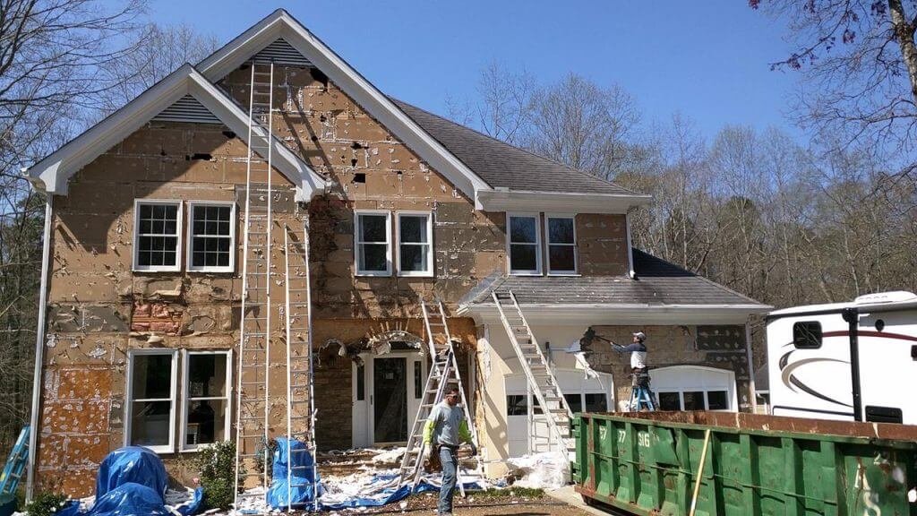 Siding Contractor by U.S. Windows & Exteriors improving a residential home exterior in Stonecrest, GA