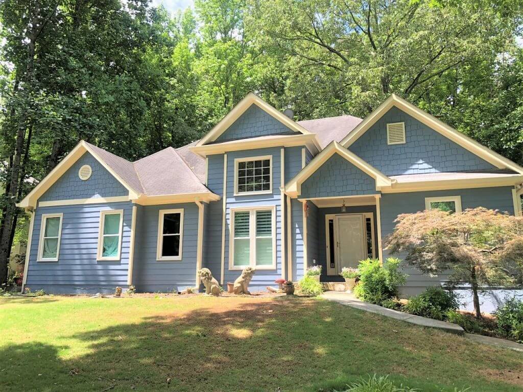 home with new blue & yellow siding